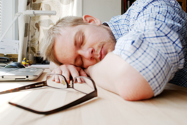 office worker sleeping on desk